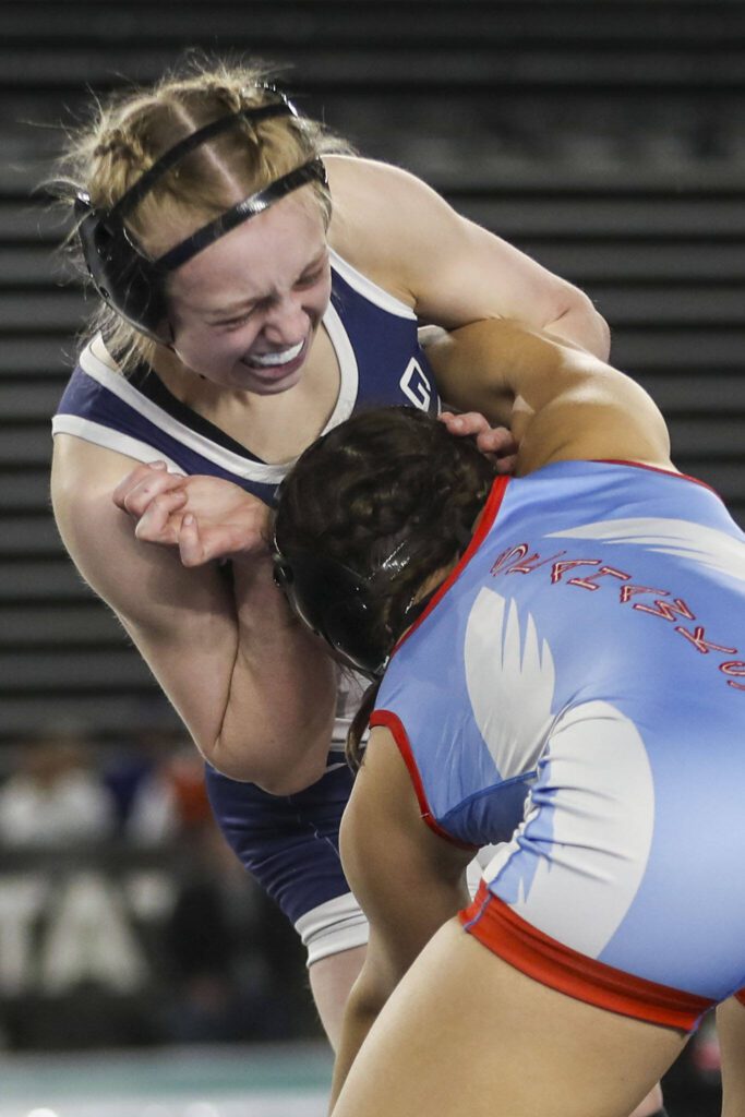 Glacier Peak’s Karianne Baldwin (top) wrestles Chief Sealth’s Sophia Andreini in the Class 3A/4A 125-pound championship match during Mat Classic XXXV on Feb. 17 at the Tacoma Dome in Tacoma. (Annie Barker / The Herald)
