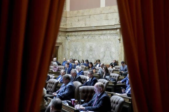 Members of the House convene on the first day of the legislative session at the Washington state Capitol, Monday, Jan. 8, 2024, in Olympia, Wash. (AP Photo/Lindsey Wasson)