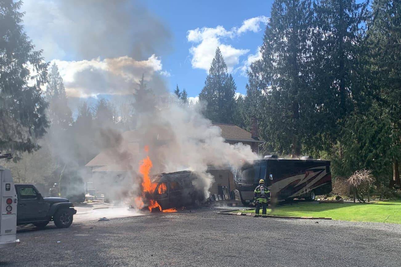 Firefighters respond to a small RV and a motorhome fire on Tuesday afternoon in Marysville. (Provided by Snohomish County Fire Distrct 22)