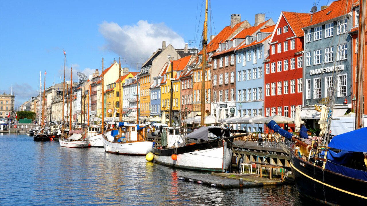The colorful Nyhavn neighborhood is the place to moor on a sunny day in Copenhagen. (Cameron Hewitt)