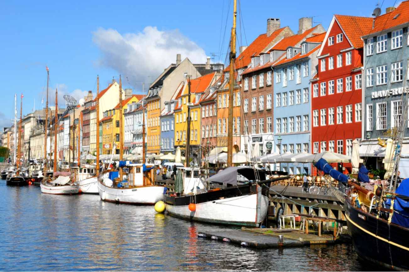 The colorful Nyhavn neighborhood is the place to moor on a sunny day in Copenhagen. (Cameron Hewitt)