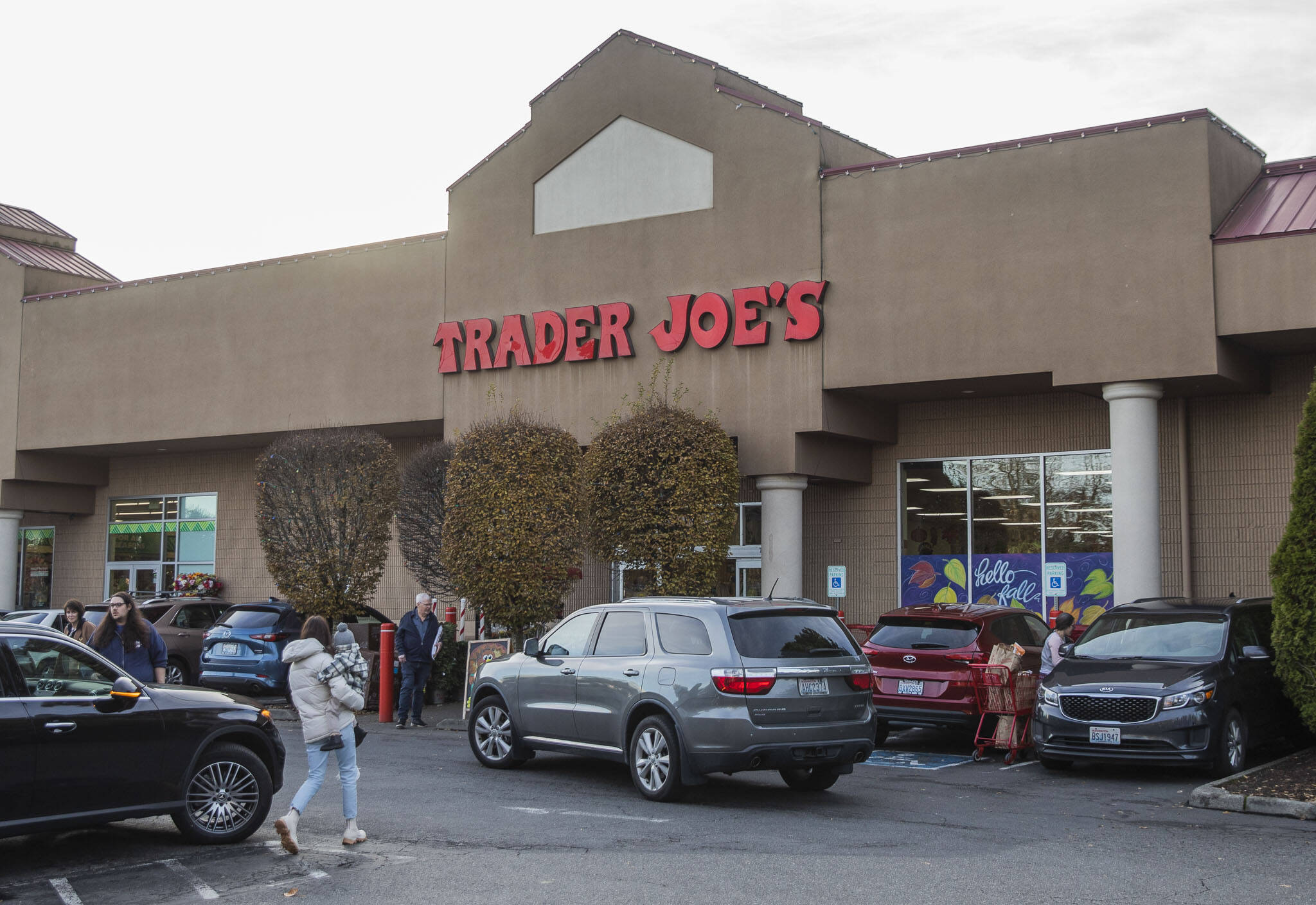 Trader Joe’s customers walk in and out of the store on Monday, Nov. 20, 2023 in Everett, Washington. (Olivia Vanni / The Herald)