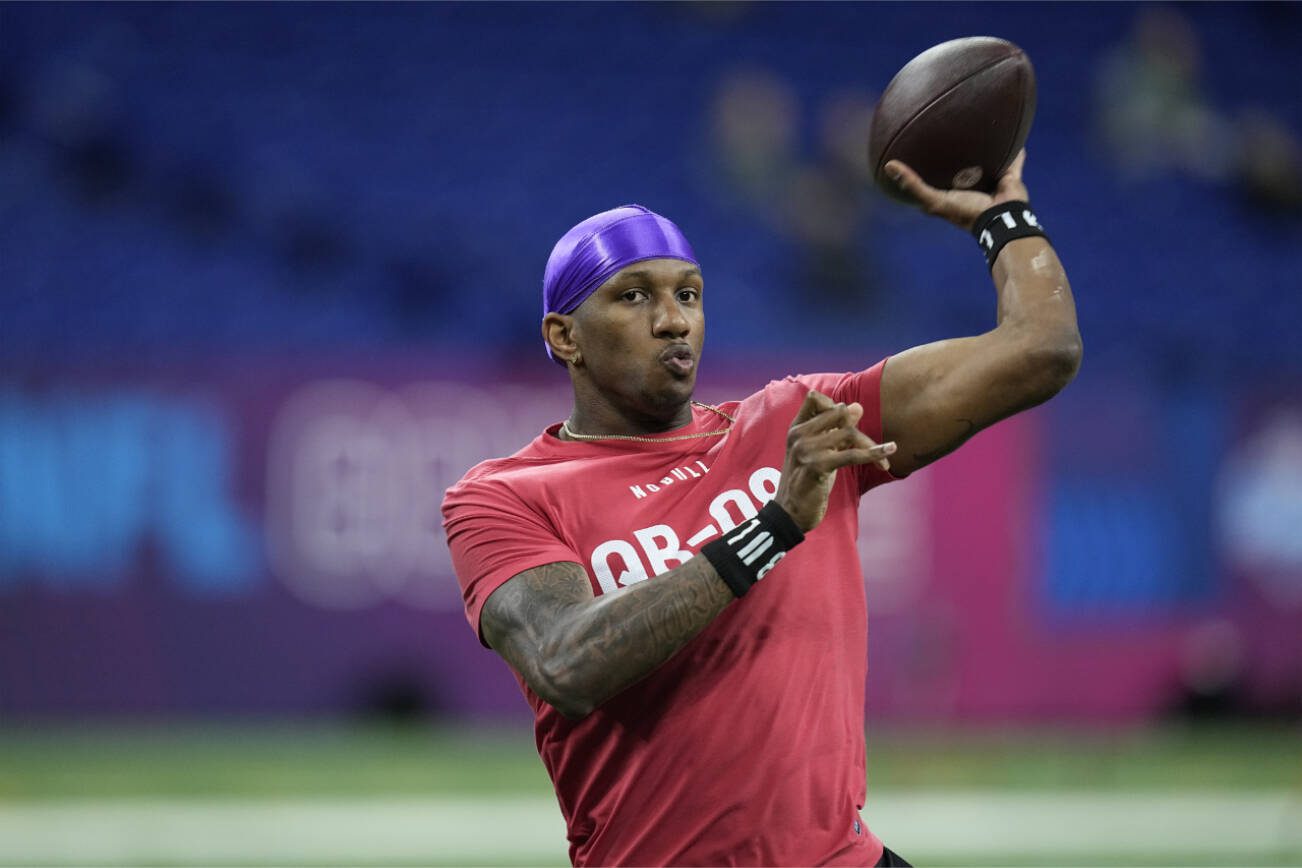 Washington quarterback Michael Penix runs a drill at the NFL football scouting combine, Saturday, March 2, 2024, in Indianapolis. (AP Photo/Darron Cummings)