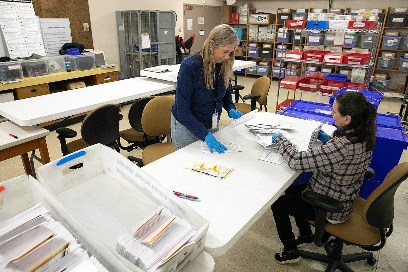 Election workers receive and sort ballots during ballot processing for the U.S. Presidential Primary on Thursday, March 7, 2024, at the County Elections Office in Everett, Washington. (Ryan Berry / The Herald)