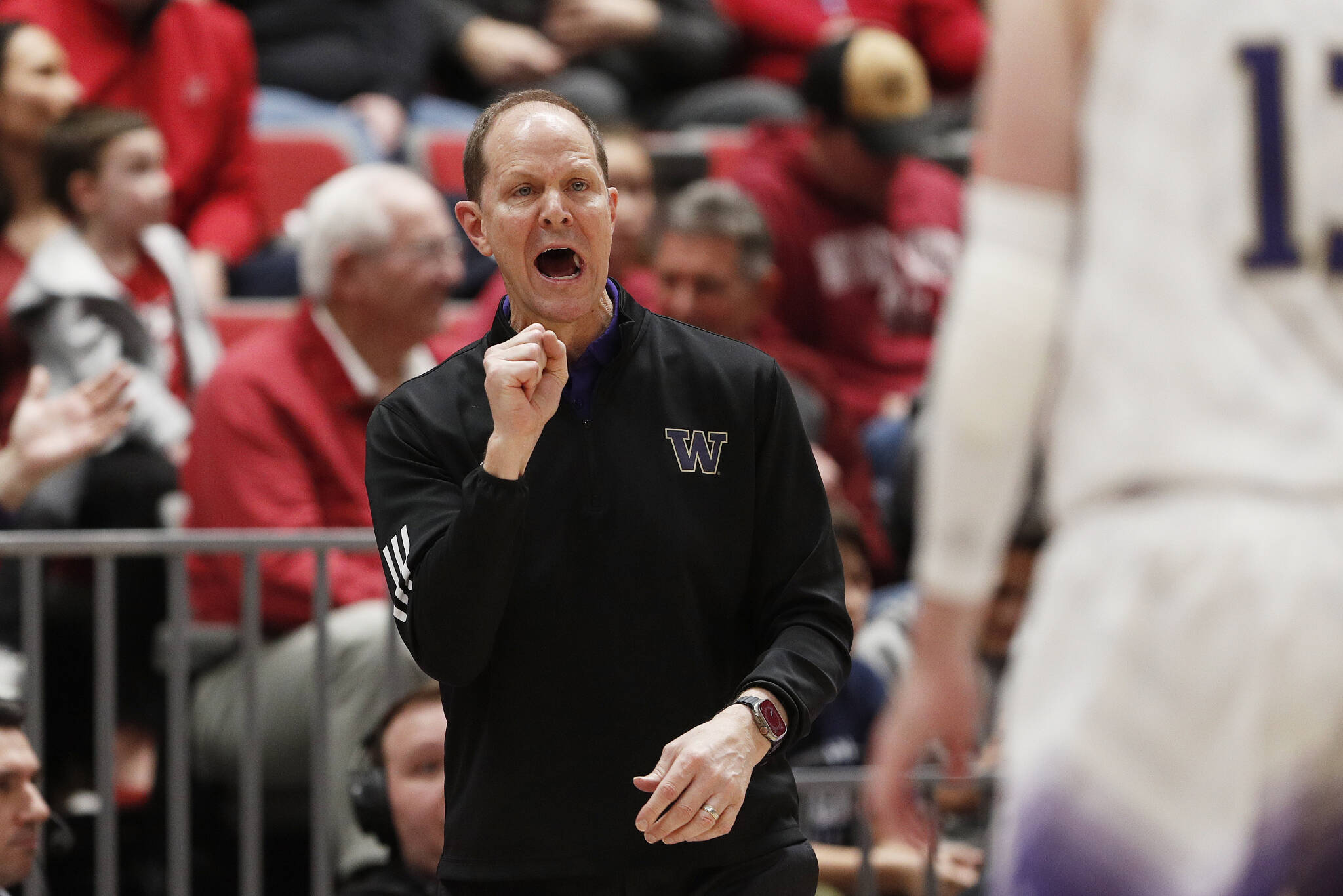 Washington head coach Mike Hopkins directs his team during the first half of a game against Washington State on Thursday in Pullman. (AP Photo/Young Kwak)