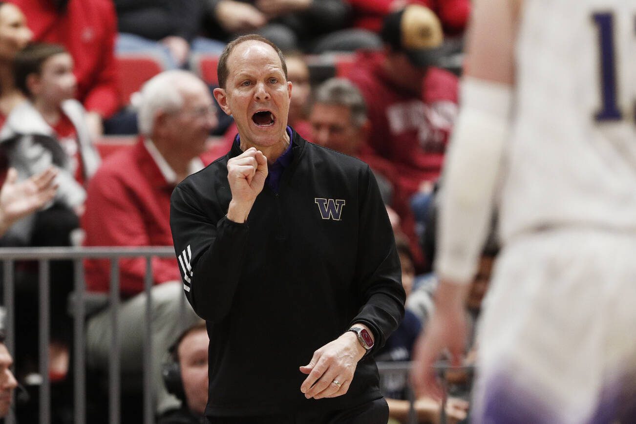 Washington head coach Mike Hopkins directs his team during the first half of an NCAA college basketball game against Washington State, Thursday, March 7, 2024, in Pullman, Wash. (AP Photo/Young Kwak)