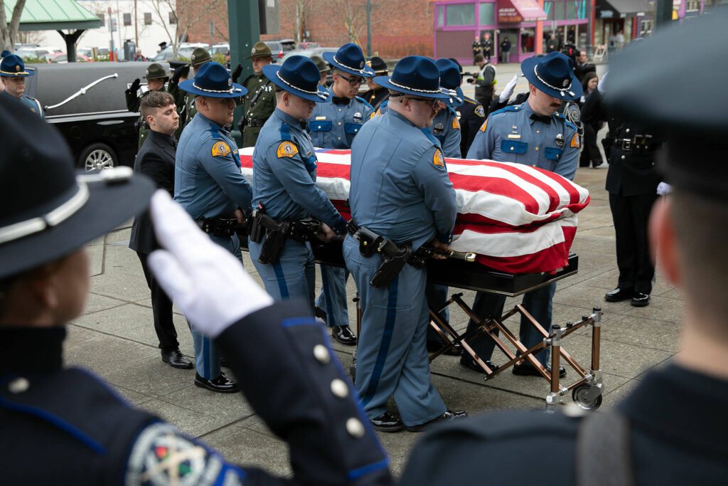 Washington State Patrol trooper Chris Gadd’s casket is transported into Angel of the Winds area for a memorial service Tuesday, March 12, 2024, in Everett, Washington. (Ryan Berry / The Herald)
