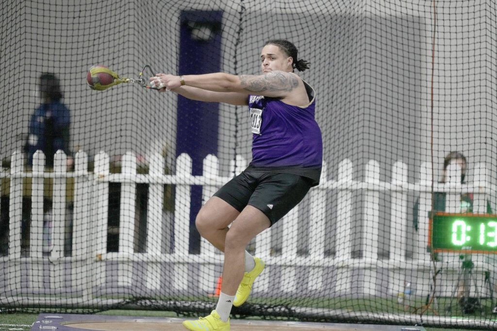 Washington&rsquo;s Jayden White, an Everett High School alum, competes in the weight throw at the Husky Classic on Feb. 12, 2022, in Seattle. White placed in the weight throw at the NCAA Indoor Championships held last weekend in Boston. (Red Box Pictures)
