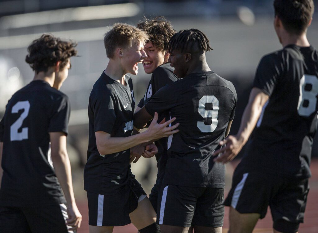 Jackson’s Ian Friedrichsen (center left) celebrates his goal with his teammates during the game against Bothell on May 11, 2023 in Everett. (Olivia Vanni / The Herald)
