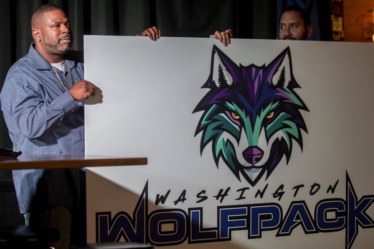 The Washington Wolfpack logo is revealed during the Everett AFL team unveiling at Tony V's Garage in Everett, Washington onThursday, Oct. 26, 2023. (Annie Barker / The Herald)