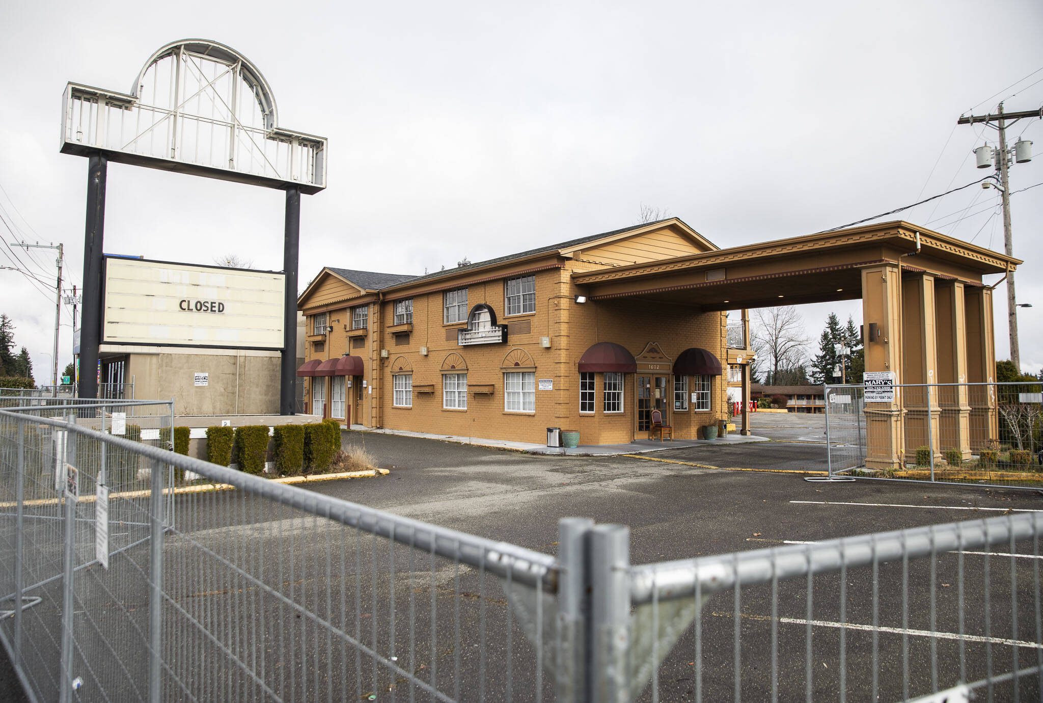 The Days Inn surrounded by fencing on Monday, Feb. 12, 2024 in Everett, Washington. (Olivia Vanni / The Herald)