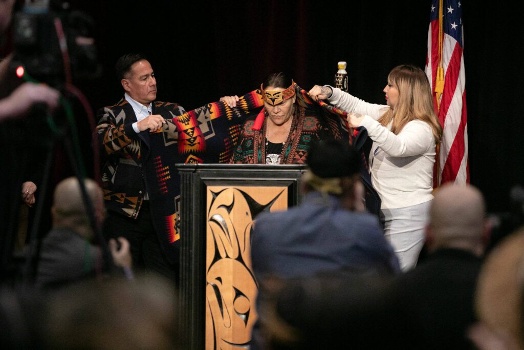 Tulalip Chair Teri Gobin is presented with a blanket by the Nisqually Tribe on Tuesday, March 19, 2024, at Tulalip Casino’s Orca Ballroom in Tulalip, Washington. (Ryan Berry / The Herald)
