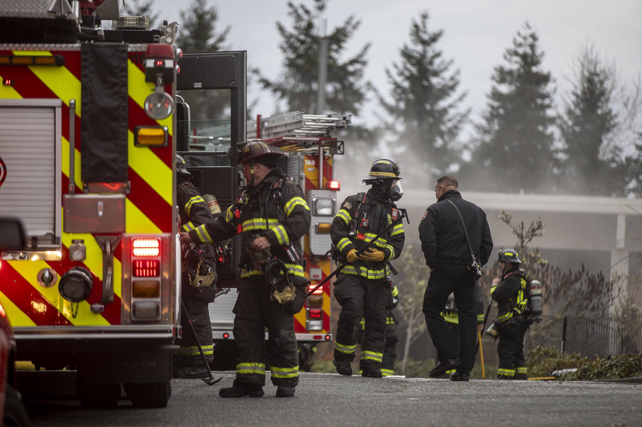South County Fire and Shoreline Fire crews respond to a fire at 7212 220th St. SW on March 20, 2024 in Edmonds, Washington. (Annie Barker / The Herald)