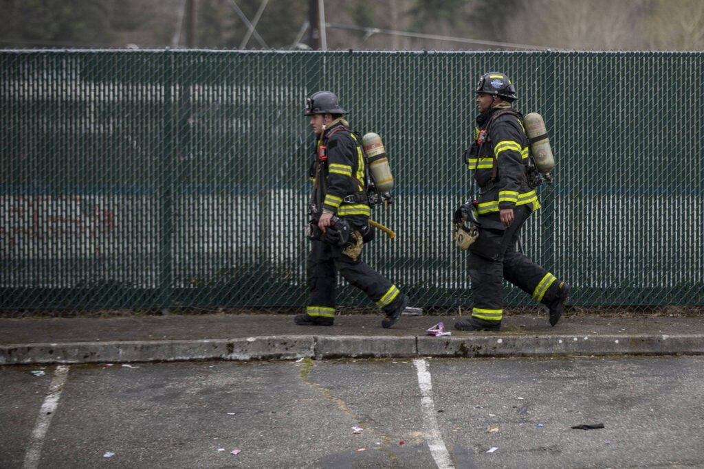 South County Fire and Shoreline Fire crews respond to a fire at 7212 220th St. SW on March 20, 2024 in Edmonds, Washington. (Annie Barker / The Herald)
