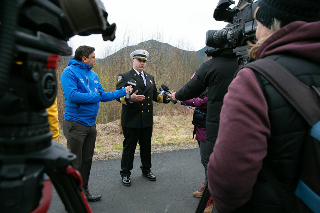 Darrington Fire Chief and Oso Fire Chaplain Joel Johnson speaks with the media following the ten-year remembrance of the Oso landslide on Friday, March 22, 2024, at the Oso Landslide Memorial in Oso, Washington. (Ryan Berry / The Herald)
