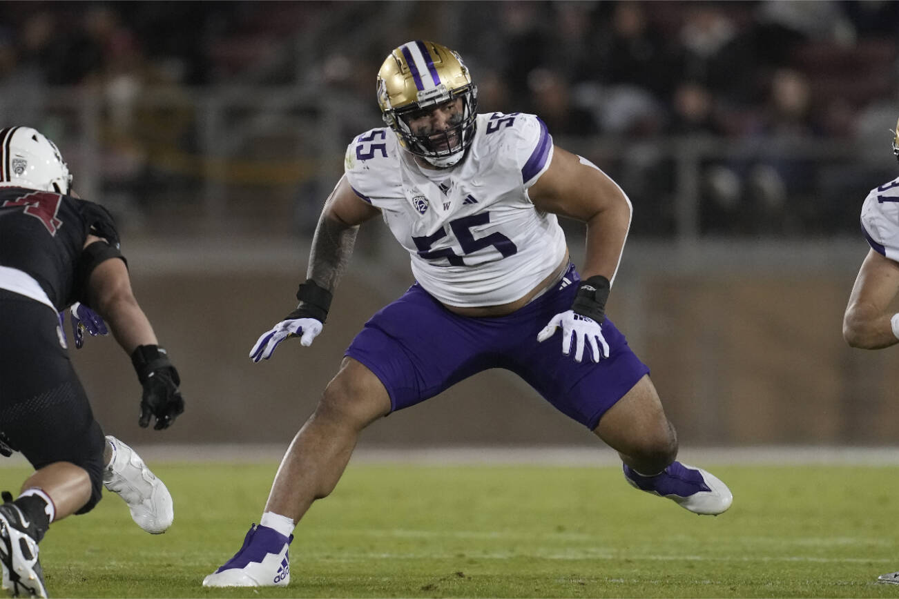 Washington offensive lineman Troy Fautanu (55) during an NCAA college football game against Stanford in Stanford, Calif., Saturday, Oct. 28, 2023. (AP Photo/Jeff Chiu)