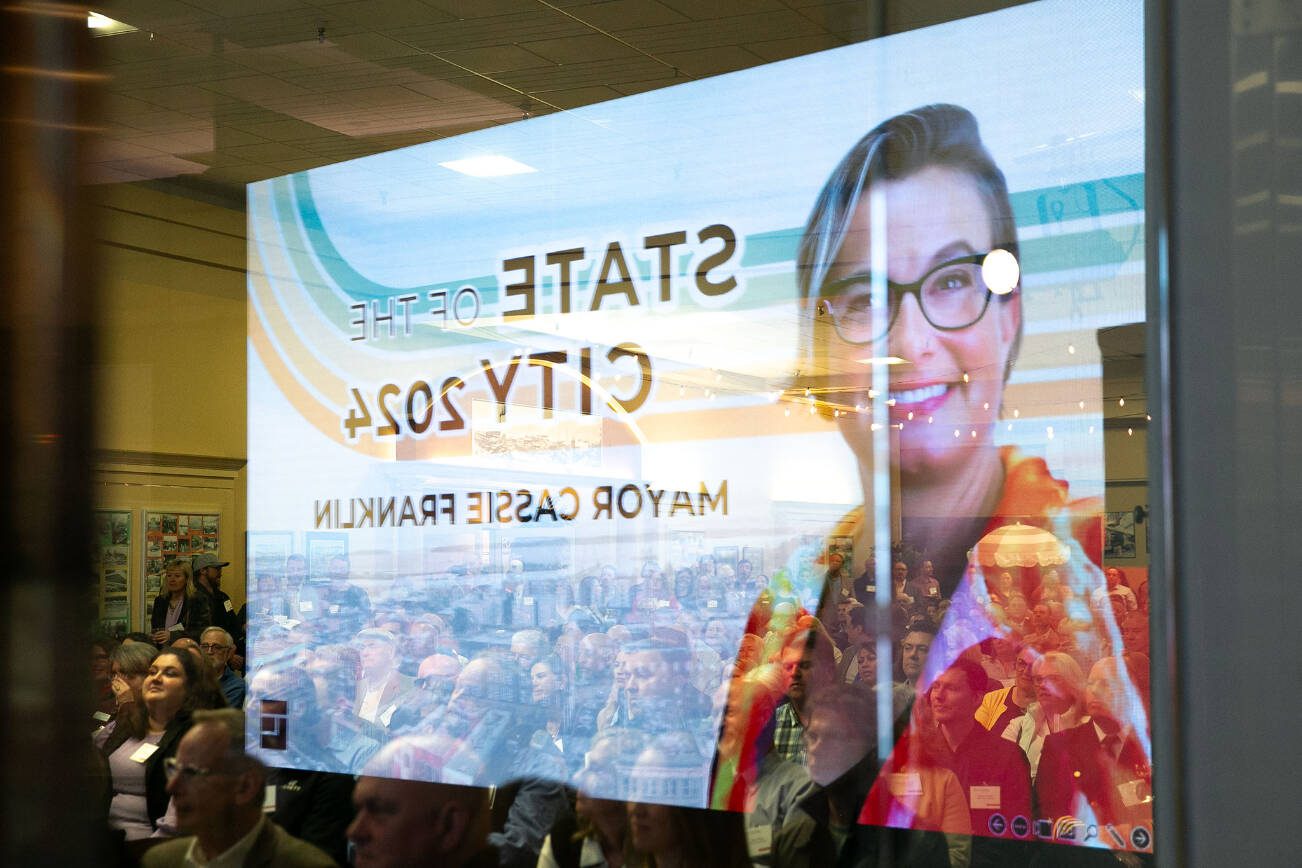 An image of Everett Mayor Cassie Franklin is reflected in a storefront window during the State of the City Address on Thursday, March 21, 2024, at thee Everett Mall in Everett, Washington. (Ryan Berry / The Herald)