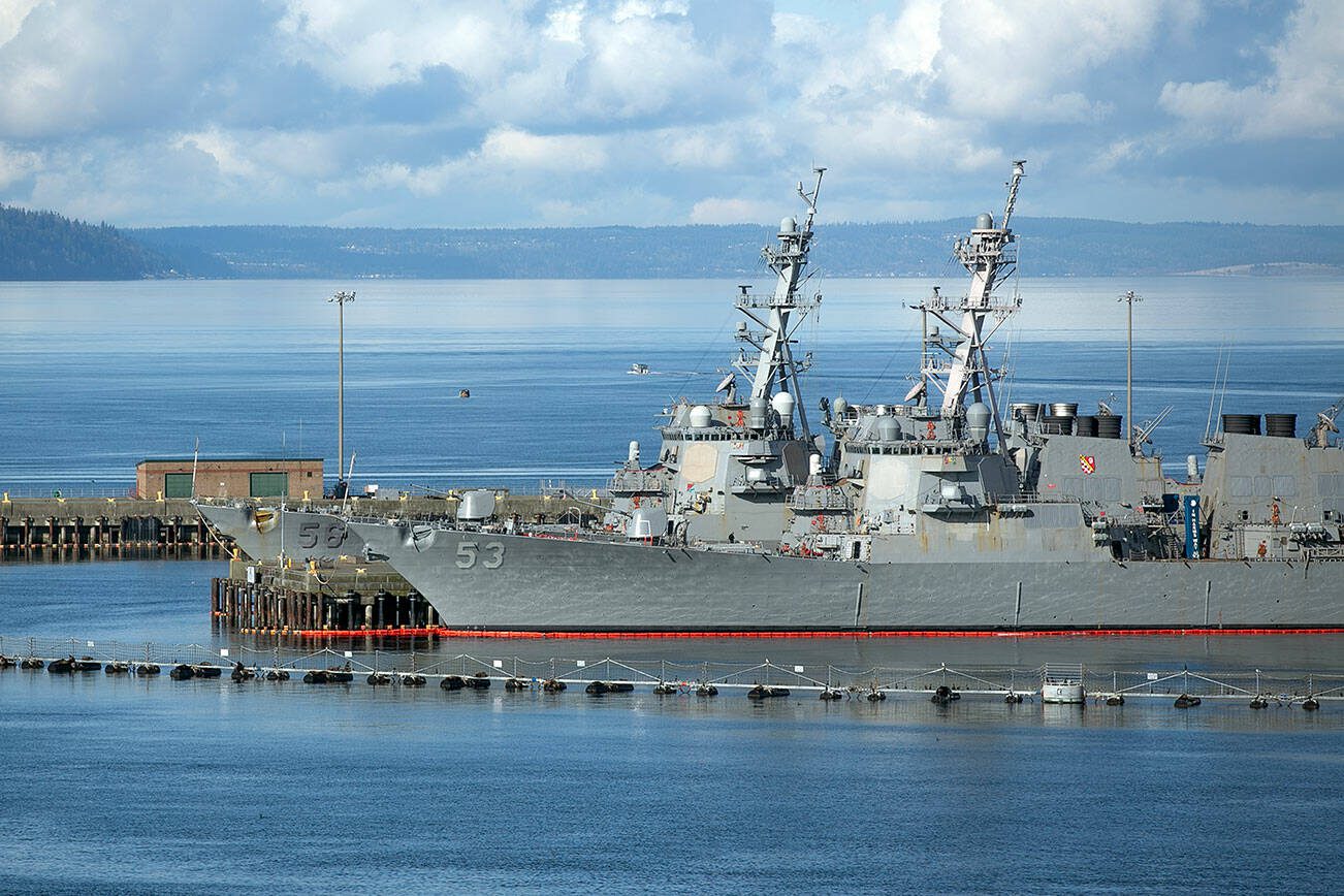 Two guided missile destroyers — the USS John McCain (56) and USS John Paul Jones (53) — sit at their homeport of Naval Station Everett on Friday, Feb. 9, 2024, in Everett, Washington. (Ryan Berry / The Herald)