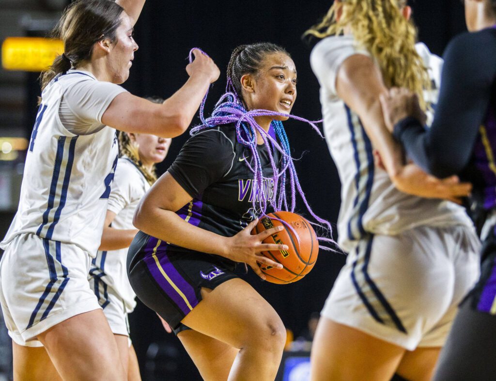 Lake Stevens’ Nisa Ellis looks for an open teammate to pass to during the 4A girls state basketball game against Gonzaga Prep on Wednesday, Feb. 28, 2024 in Tacoma. (Olivia Vanni / The Herald)
