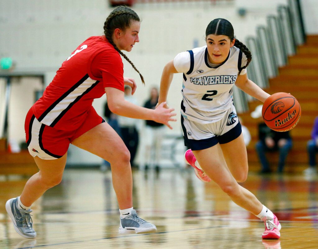 Meadowdale’s Gia Powell tries to get past a defender against Snohomish during the 3A District 1 semifinals on Wednesday, Feb. 14, 2024, at Marysville Pilchuck High School in Marysville. (Ryan Berry / The Herald)
