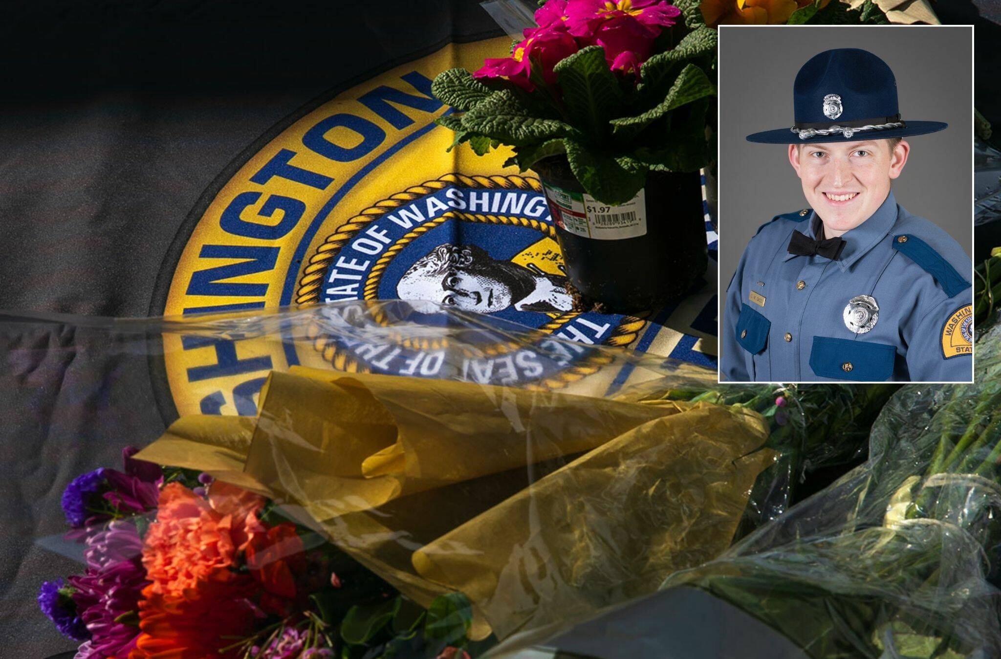 Flowers for slain trooper Chris Gadd begin to collect outside Washington State Patrol District 7 Headquarters on Saturday, March 2, 2024, in Marysville, Washington. (Ryan Berry / The Herald)