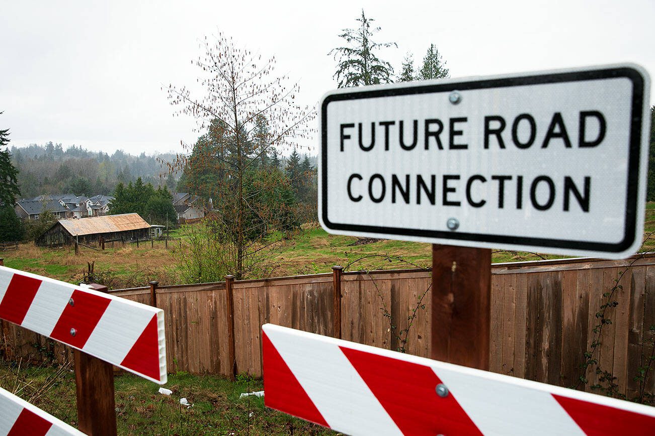 The rezoned property, seen here from the Hillside Vista luxury development, is surrounded on two sides by modern neighborhoods Monday, March 25, 2024, in Lake Stevens, Washington. (Ryan Berry / The Herald)