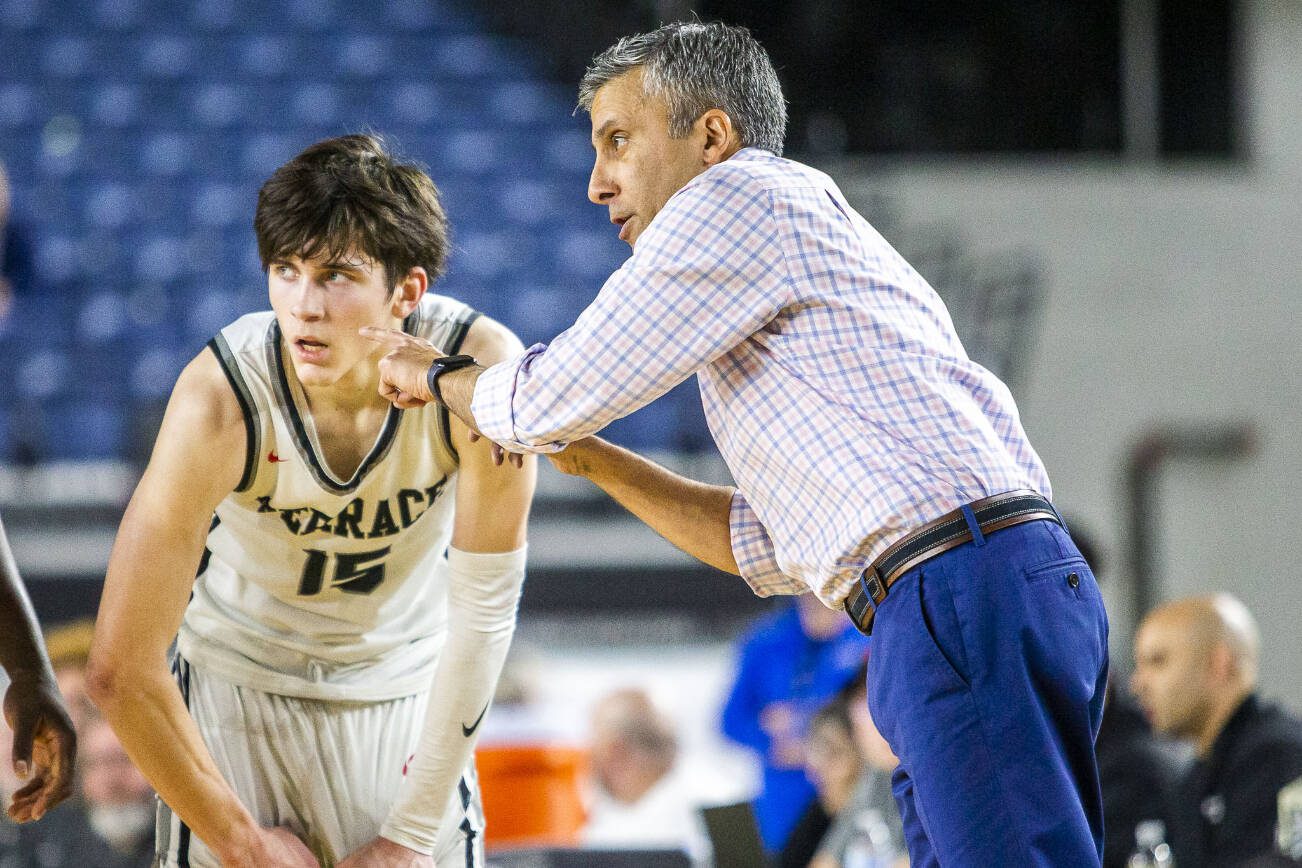 Mountlake Terrace’s Jaxon Dubiel talks with head coach Nalin Sood during the 3A boys state basketball game against Todd Beamer on Wednesday, Feb. 28, 2024 in Tacoma, Washington. (Olivia Vanni / The Herald)