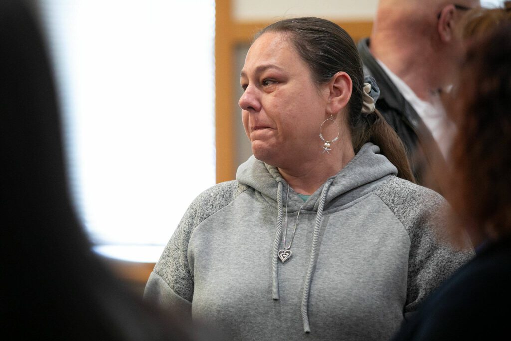 Kelli Littlejohn, who was 11 when her older sister Melissa Lee was murdered, speaks to a group of investigators to thank them for bringing closure to her family after over 30 years on Thursday, March 28, 2024, at Snohomish County Superior Court in Everett, Washington. (Ryan Berry / The Herald)
