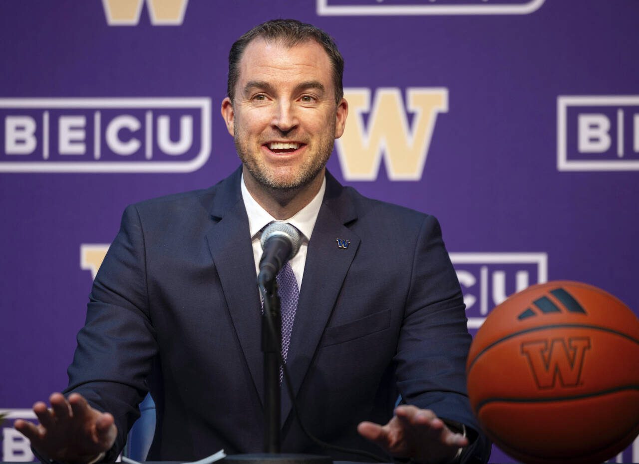 University of Washington’s new men’s basketball coach Danny Sprinkle meets the news media Wednesday in Seattle. (Ken Lambert/The Seattle Times via AP)
