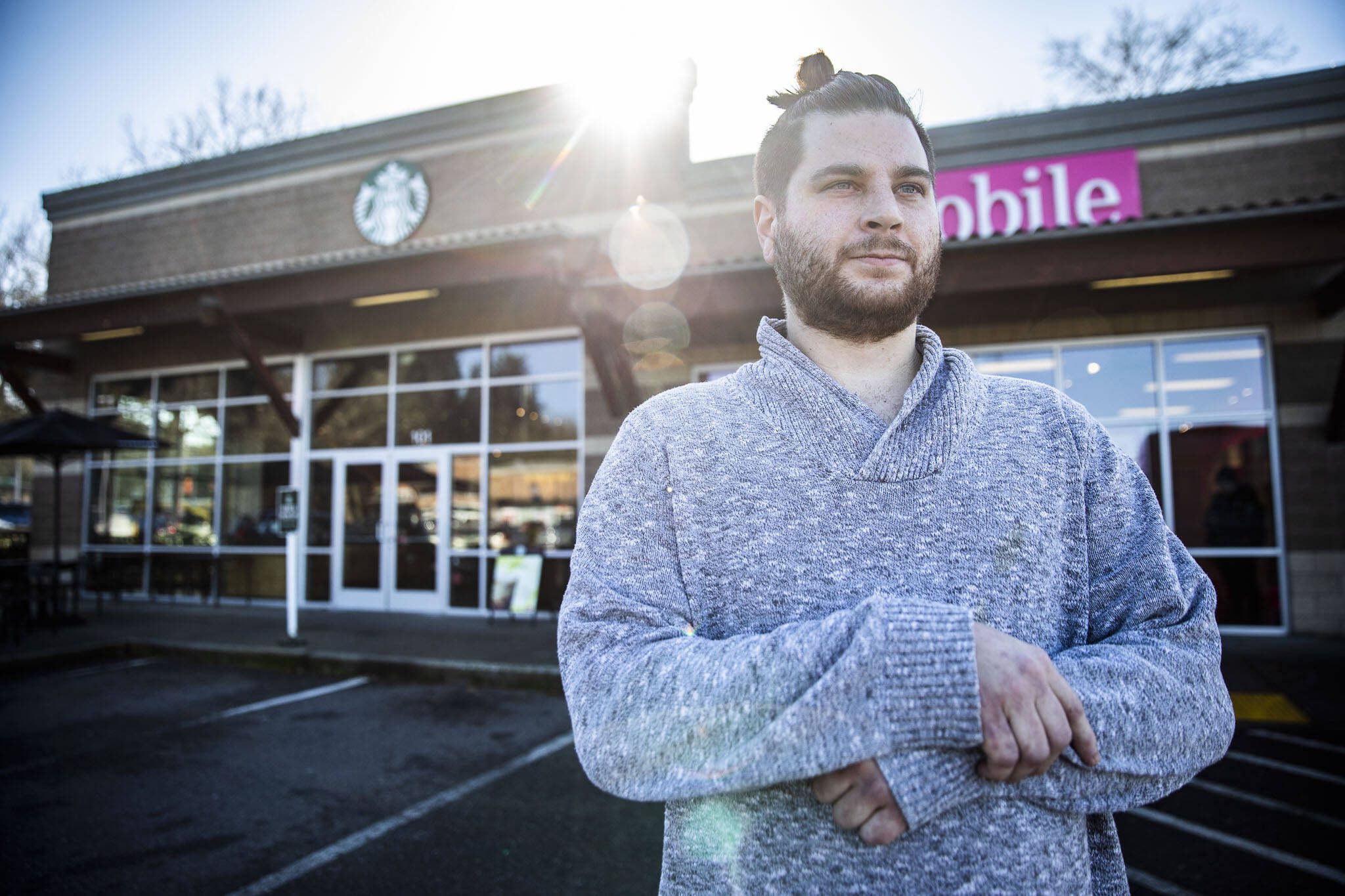 Starbucks employee Zach Gabelein outside of the Mill Creek location where he works on Friday, Feb. 23, 2024 in Mill Creek, Washington. (Olivia Vanni / The Herald)