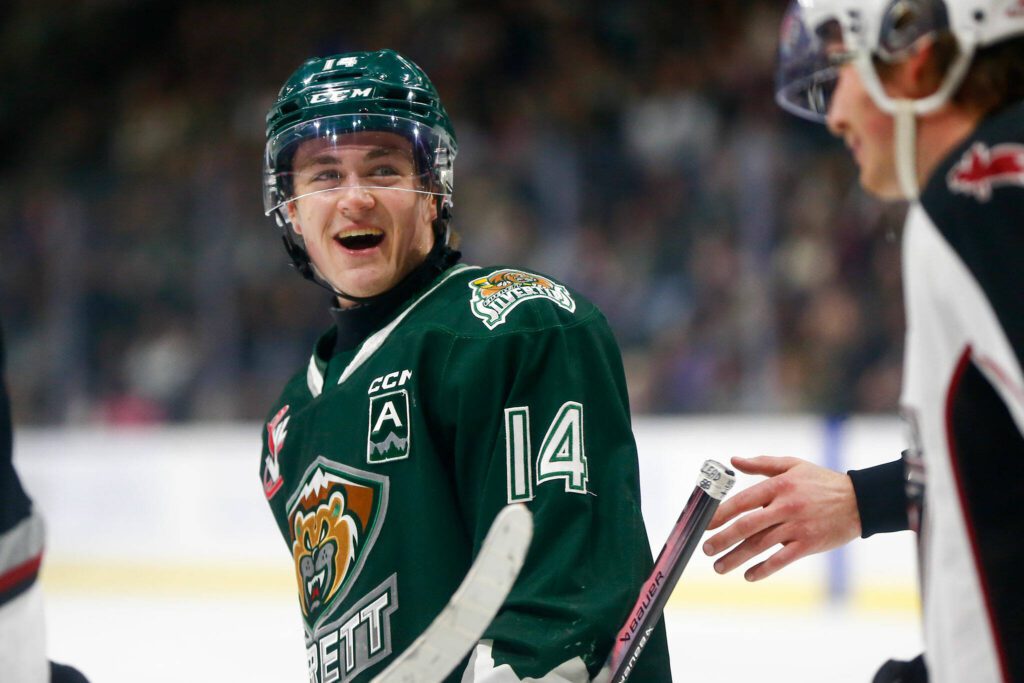 Everett Silvertips forward Austin Roest talks with a Vancouver Giants player after the whistle during the 2024 playoff opener on Friday, March 29, 2024, at Angel of the Winds Arena in Everrett, Washington. (Ryan Berry / The Herald)
