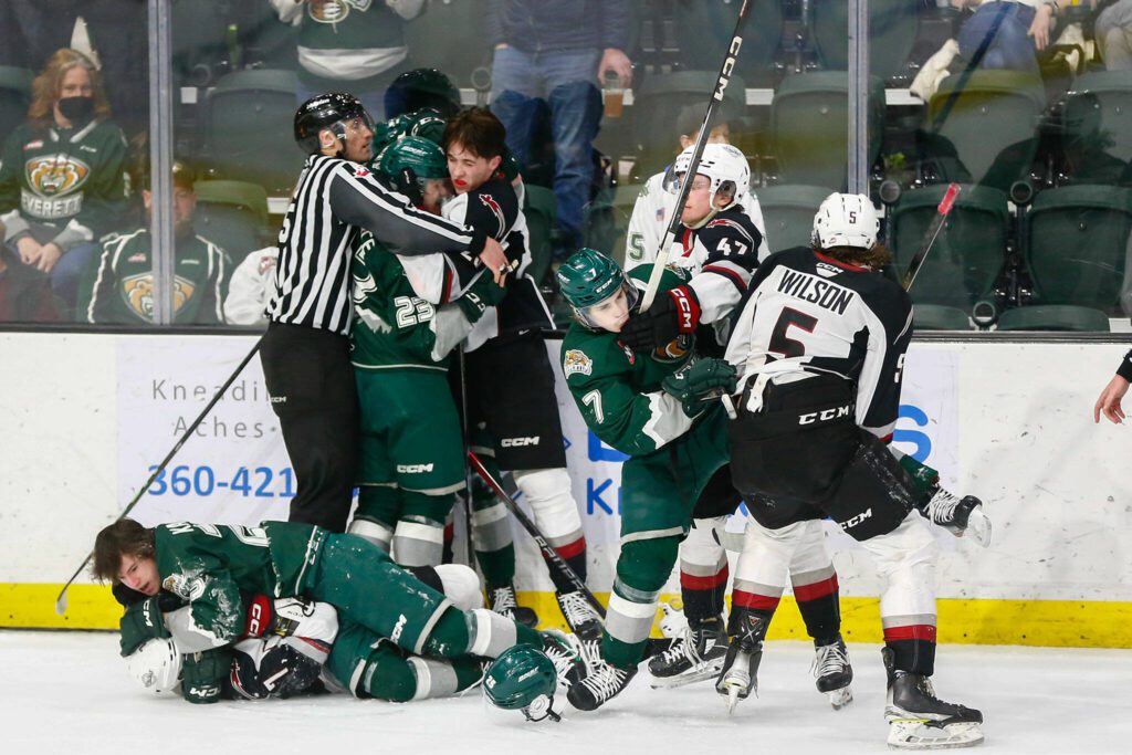 The Silvertips and Giants go at it after the final horn of the 2024 playoff opener on Friday, March 29, 2024, at Angel of the Winds Arena in Everrett, Washington. (Ryan Berry / The Herald)
