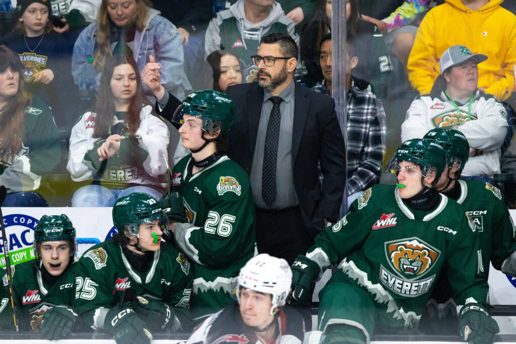 Everett Silvertips head coach and GM Dennis Williams stands on the bench while directing his team during the 2024 playoff opener against the Vancouver Giants on Friday, March 29, 2024, at Angel of the Winds Arena in Everrett, Washington. (Ryan Berry / The Herald)

