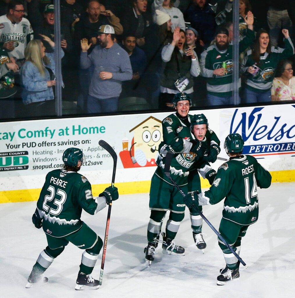 The Everett Silvertips celebrate Ben Hemmerling’s second goal of the night against the Vancouver Giants during the 2024 playoff opener on Friday, March 29, 2024, at Angel of the Winds Arena in Everrett, Washington. (Ryan Berry / The Herald)
