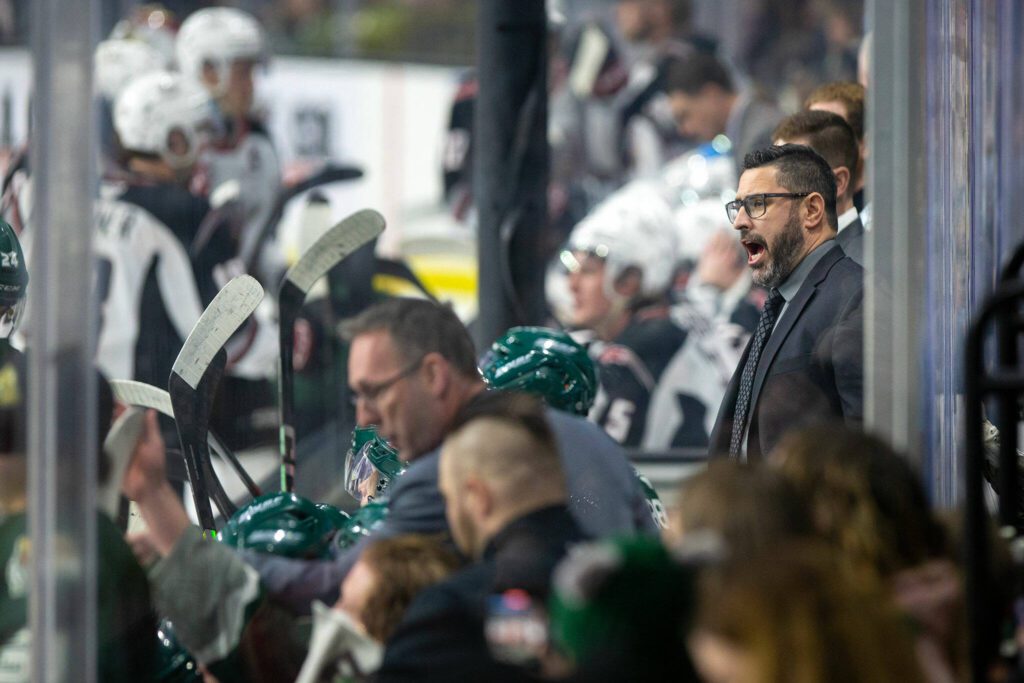 Everett Silvertips head coach and GM Dennis Williams instructs his players from behind the bench during the playoff opener against the Vancouver Giants on Friday, March 29, 2024, at Angel of the Winds Arena in Everrett, Washington. (Ryan Berry / The Herald)
