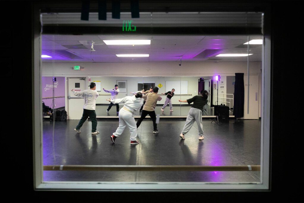 The troupe works on memorizing a dance sequence. (Ryan Berry / The Herald)
