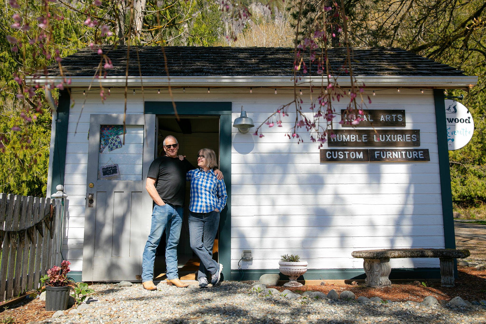 Allan and Frances Peterson, a woodworker and artist respectively, stand in the door of the old horse stall they turned into Milkwood on Sunday, March 31, 2024, in Index, Washington. (Ryan Berry / The Herald)