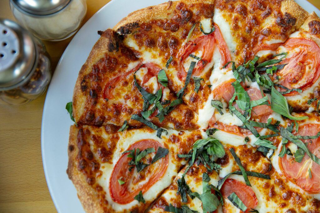 A Margherita pizza at Boston’s Restaurant & Sports Bar on Monday, March 18, 2024, in Smokey Point, Washington. (Ryan Berry / The Herald)
