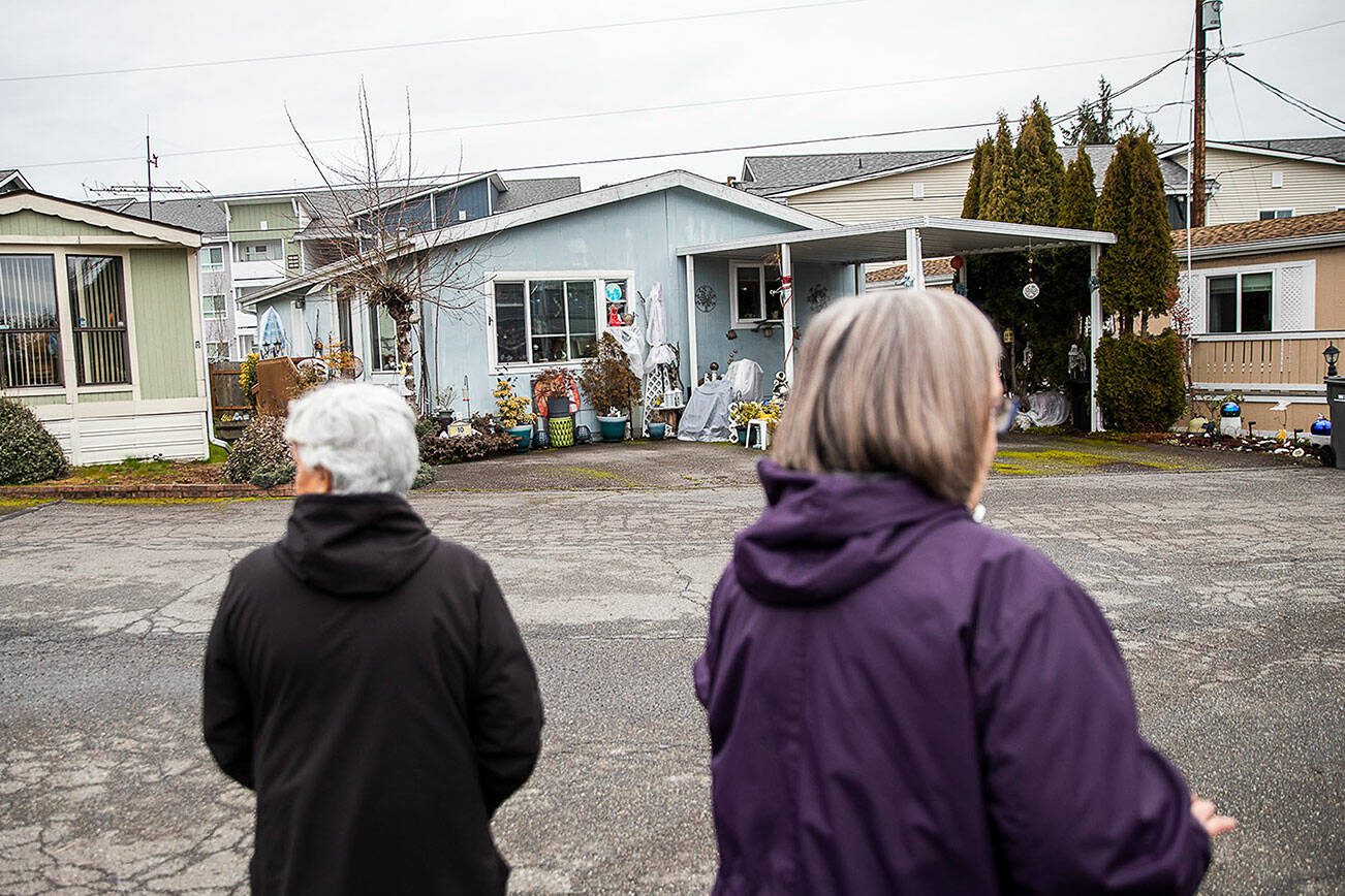 Royalwood Estates Mobile Home Park residents Patsy Gilbert, left, and Elna Olson, right, give a brief tour of the mobile home park on Monday, March 11, 2024 in Lynnwood, Washington. (Olivia Vanni / The Herald)