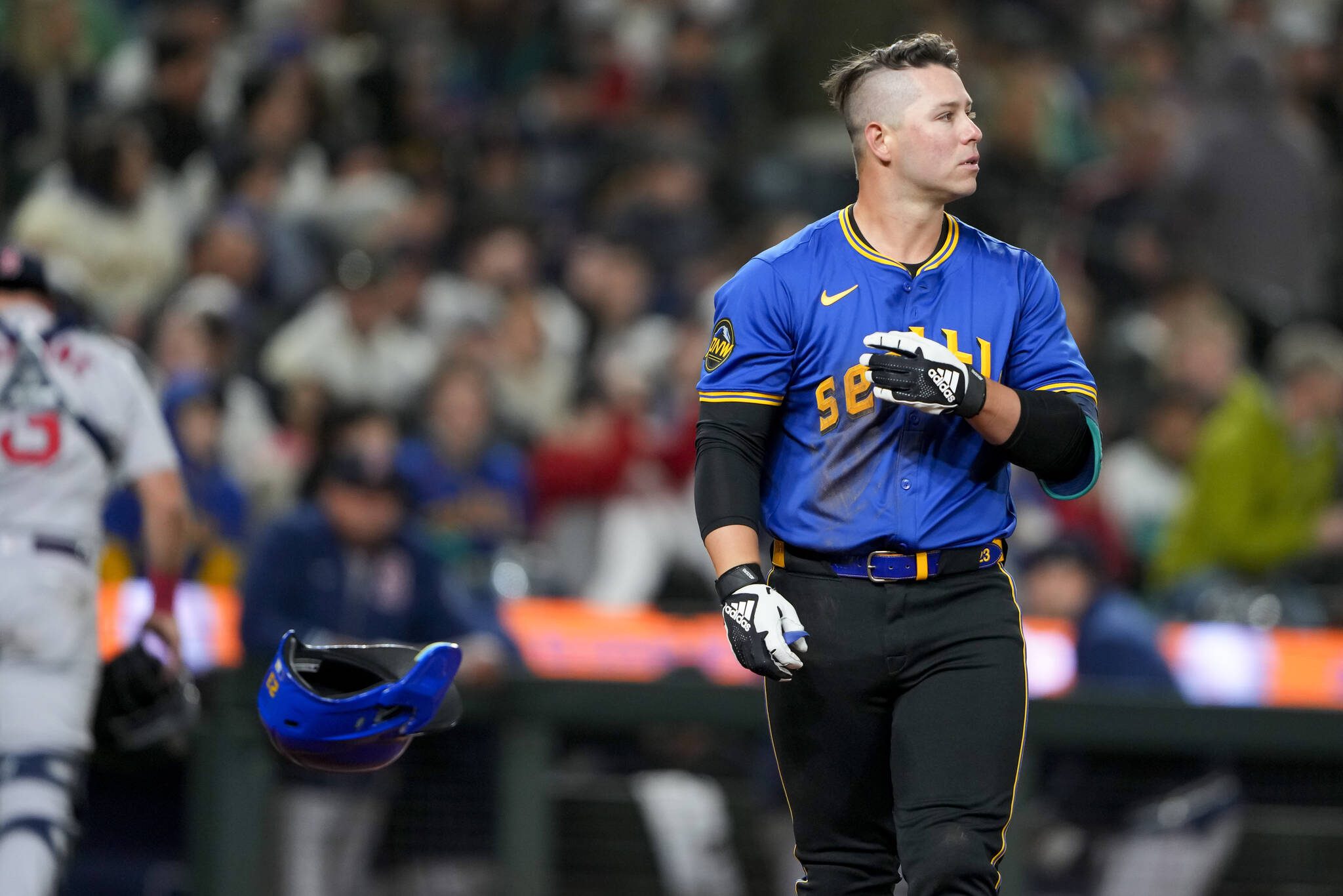 Seattle Mariners’ Ty France tosses his helmet after striking out against the Boston Red Sox in a baseball game Friday, March 29, 2024, in Seattle. (AP Photo/Lindsey Wasson)