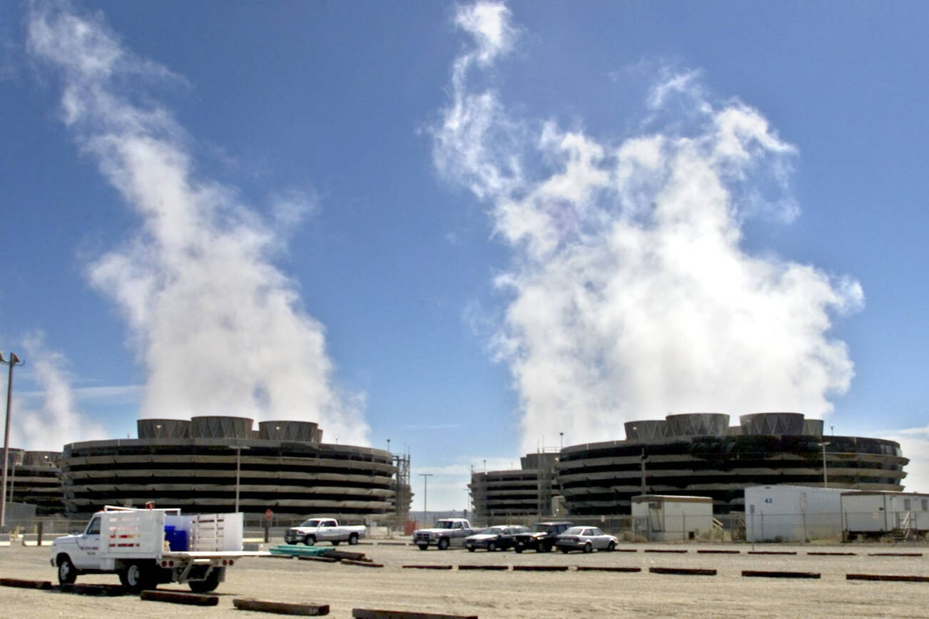 FILE - In this April 8, 2003, file photo, steam rises from the Columbia Generating Station, Washington state's only nuclear power plant, near Richland, Wash. The nuclear power plant in southeastern Washington state closed unexpectedly. The Tri-City Herald reports that the Columbia Generating Station's systems detected a problem Friday May 18, 2018, having to do with electrical distribution and automatically shut the plant down. Authorities said there is no risk to the public. (AP Photo/Jackie Johnston, File)