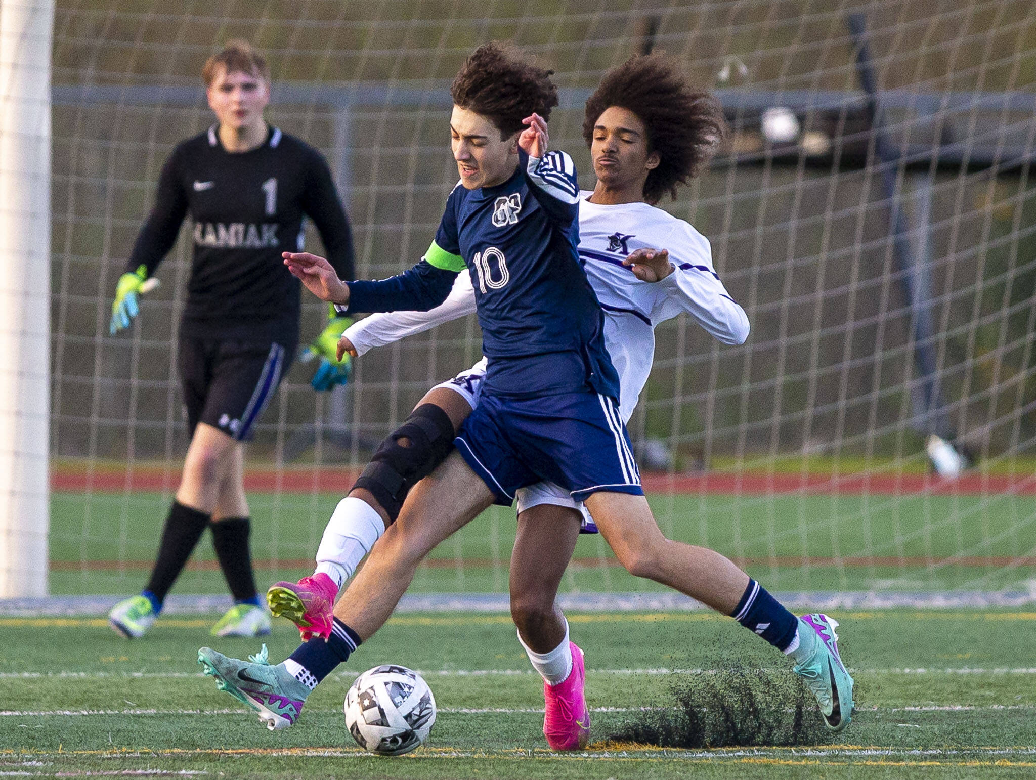 Glacier Peak’s Nicholas Miller attempts to keep the ball away from Kamiak’s Saikou Bojang during the game on Monday, April 1, 2024 in Snohomish, Washington. (Olivia Vanni / The Herald)