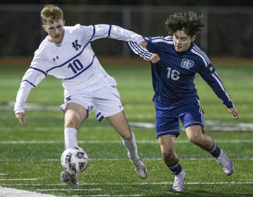 Kamiak’s Roman Bogutskyi and Glacier Peak’s Dylan Bryant scramble for the ball during the game on Monday, April 1, 2024 in Snohomish, Washington. (Olivia Vanni / The Herald)
