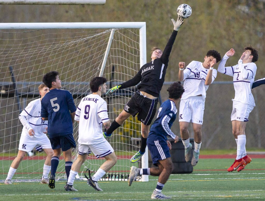 Kamiak’s Otto Richter leaps in the air to block an incoming corner kick during the game against Glacier Peak on Monday, April 1, 2024 in Snohomish, Washington. (Olivia Vanni / The Herald)
