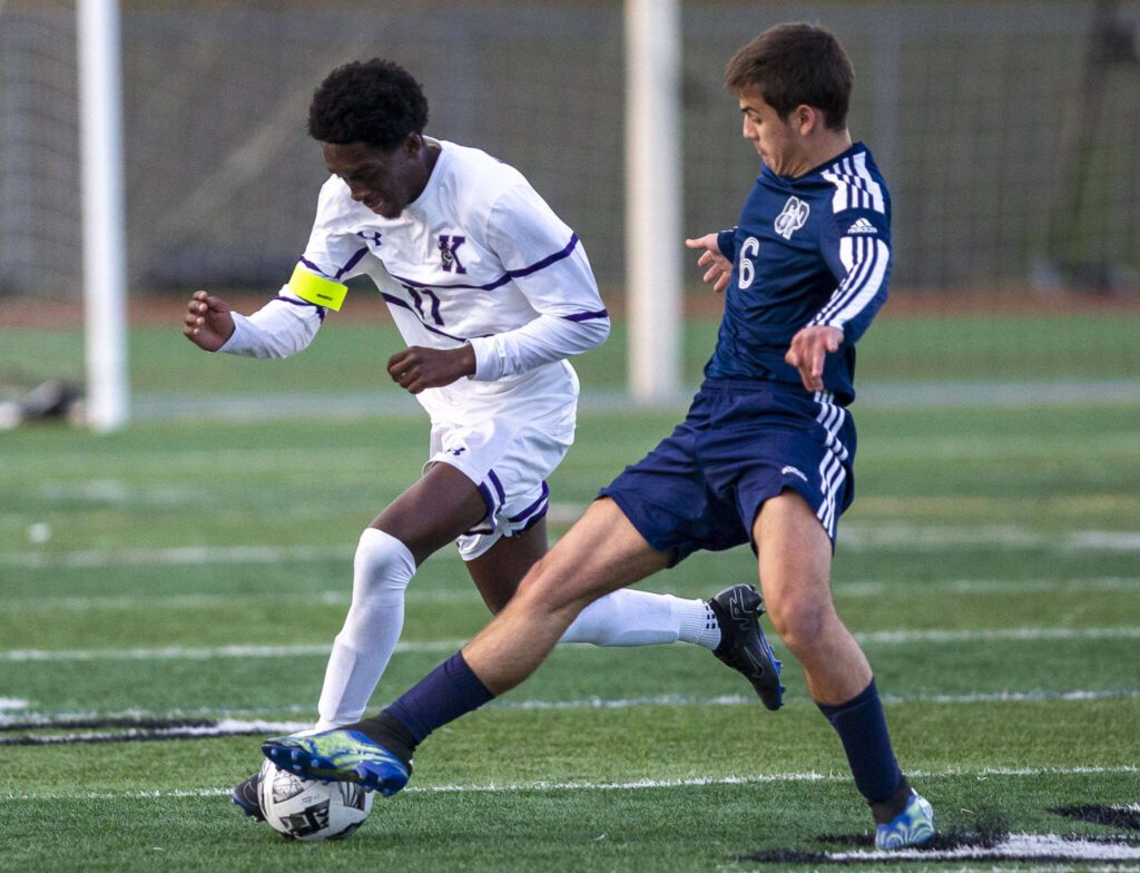 Glacier Peak’s Alessandro Onnis sticks out his foot to try and knock the ball away from Kamiak’s Caleb Peter during the game on Monday, April 1, 2024 in Snohomish, Washington. (Olivia Vanni / The Herald)
