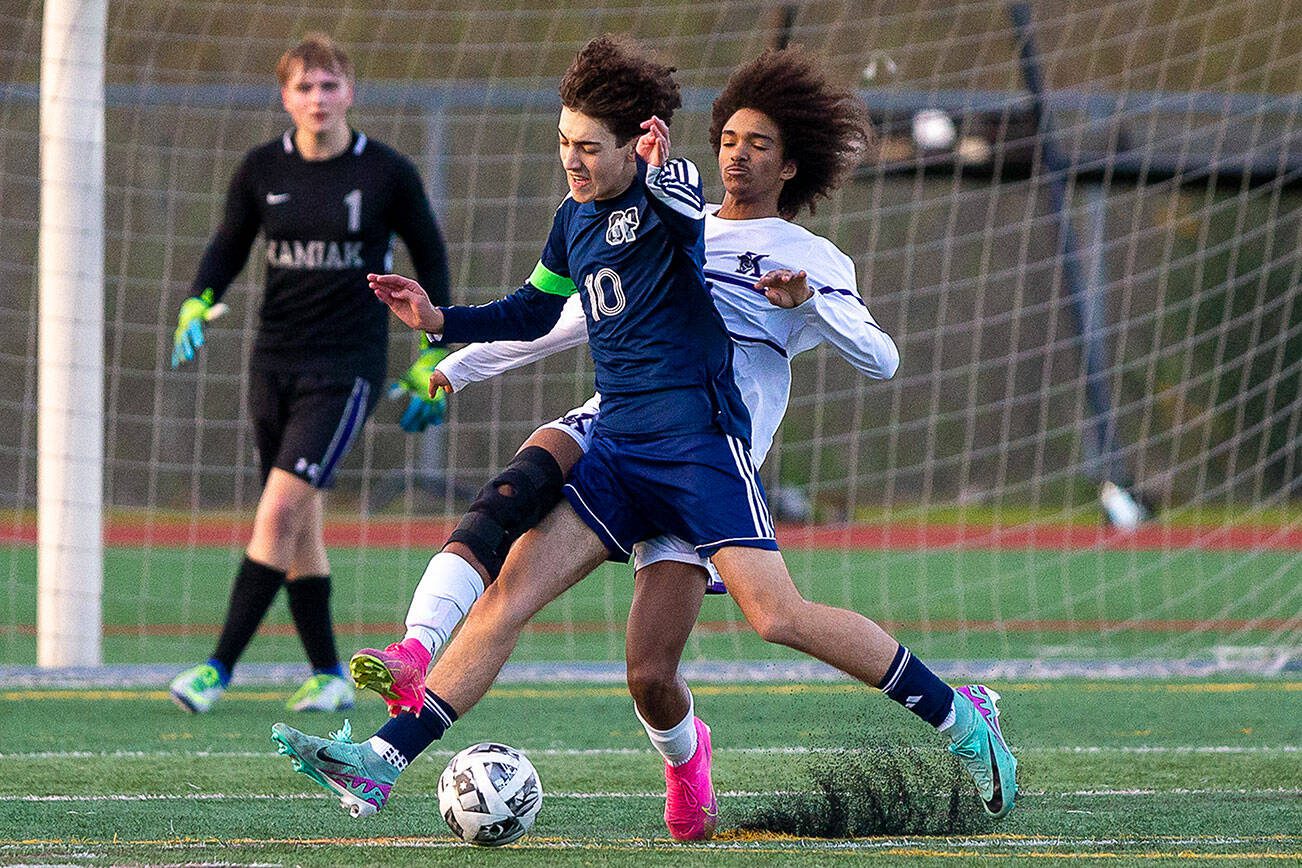 Glacier Peak’s Nicholas Miller attempts to keep the ball away from Kamiak’s Saikou Bojang during the game on Monday, April 1, 2024 in Snohomish, Washington. (Olivia Vanni / The Herald)