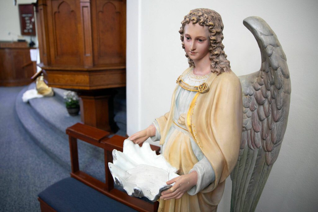 A baptismal font used for generations rests towards the front of the sanctuary at Zion Lutheran Church on Monday, April 1, 2024, in Snohomish, Washington. (Ryan Berry / The Herald)
