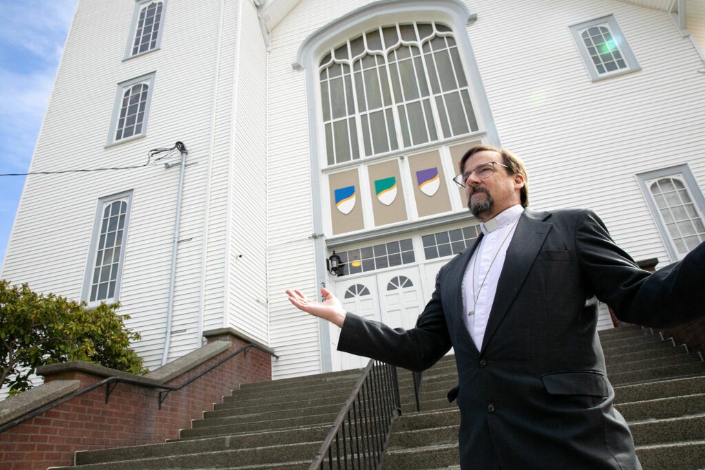 Pastor Don Stults stands in front of Zion Lutheran Church while speaking about the history of the building on Monday, April 1, 2024, in Snohomish, Washington. (Ryan Berry / The Herald)
