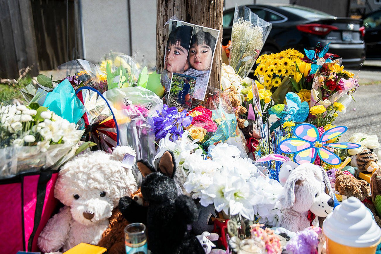 A memorial with small gifts surrounded a utility pole with a photograph of Ariel Garcia at the corner of Alpine Drive and Vesper Drive ion Wednesday, April 10, 2024 in Everett, Washington. (Olivia Vanni / The Herald)
