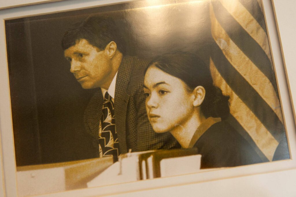 A mock trial photo of a young Whitney Rivera, who begins her appointment to Snohomish County Superior Court in May, hangs on her office wall on Thursday, April 18, 2024, in Edmonds, Washington. (Ryan Berry / The Herald)
